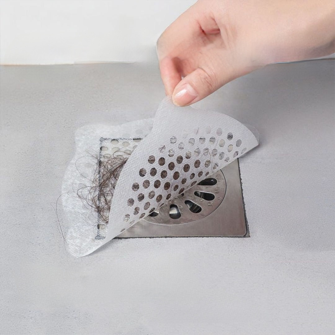 Miếng lọc rác nhà tắm dán trên bề mặt sạch